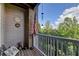 A cozy wooden patio with a bench, American flag, and peaceful view of the surrounding greenery at 1965 Nocturne Dr # 1205A, Alpharetta, GA 30009