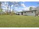 Expansive backyard with lush green grass and natural landscape in a serene outdoor setting at 327 Thornton Sw St, Atlanta, GA 30315