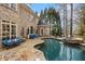 Backyard view featuring a swimming pool, hot tub, and patio seating at 110 Mattison Cv, Atlanta, GA 30319