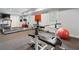 Basement gym with carpet floors, a treadmill, weight rack, and plenty of workout space at 110 Mattison Cv, Atlanta, GA 30319