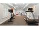 Finished basement gym area with stationary bike, treadmill, and weightlifting equipment at 110 Mattison Cv, Atlanta, GA 30319