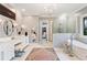 Elegant primary bathroom with double vanity, freestanding tub, and glass shower at 110 Mattison Cv, Atlanta, GA 30319