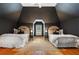 Bedroom featuring matching twin beds, hardwood floors, and an eye-catching black ceiling at 110 Mattison Cv, Atlanta, GA 30319