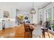 Dining room with hardwood floors, white trim, and many windows for natural light at 110 Mattison Cv, Atlanta, GA 30319