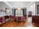 Formal dining room with hardwood floors, elegant decor, and large windows, perfect for entertaining guests at 110 Mattison Cv, Atlanta, GA 30319