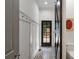 Hallway with black and white hexagon floors and coat hooks at 110 Mattison Cv, Atlanta, GA 30319