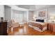 Bedroom featuring a seating nook, bay windows, hardwood floors, and great natural light at 110 Mattison Cv, Atlanta, GA 30319