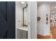 Transitional powder room with hardwood floors and a marble vanity at 110 Mattison Cv, Atlanta, GA 30319