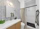 Stylish bathroom with patterned wallpaper, modern vanity, and walk-in shower at 1805 Harvard Ave # 306, College Park, GA 30337