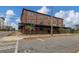 Brick multi-level loft style apartment building exterior with a dark roof at 1805 Harvard Ave # 306, College Park, GA 30337