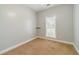 Neutral bedroom features carpet flooring, a window bringing in natural light, and gray-painted walls at 217 Chad Ln, Loganville, GA 30052