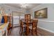 Charming dining area with a wooden table and chairs, perfect for Gathering meals at 217 Chad Ln, Loganville, GA 30052