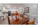 Cozy dining area featuring a wooden table and chairs, with views into the kitchen at 217 Chad Ln, Loganville, GA 30052