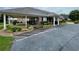 Charming single-story brick building with a covered parking area and manicured landscaping at 217 Chad Ln, Loganville, GA 30052