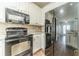 Updated kitchen featuring stainless steel appliances, white cabinets, and stylish backsplash at 217 Chad Ln, Loganville, GA 30052