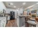 Bright kitchen featuring white cabinets, modern appliances, and a convenient breakfast bar at 217 Chad Ln, Loganville, GA 30052