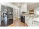 Modern kitchen with stainless steel appliances, white cabinets, and stylish countertops at 217 Chad Ln, Loganville, GA 30052