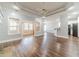 Open living area with hardwood floors connecting to the kitchen and breakfast nook at 217 Chad Ln, Loganville, GA 30052