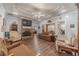 Cozy living room featuring a stone fireplace, hardwood floors, and a comfortable seating arrangement at 217 Chad Ln, Loganville, GA 30052