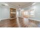 Bright living room with hardwood floors, stone fireplace, and abundant natural light at 217 Chad Ln, Loganville, GA 30052