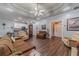 Open living area with hardwood floors, neutral paint, and seamless flow to the kitchen at 217 Chad Ln, Loganville, GA 30052