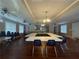 Large open-concept meeting room with hardwood floors, ample seating, and natural light at 217 Chad Ln, Loganville, GA 30052