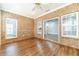 Bright sun room with brick walls, wood floors, and large windows offering plenty of natural light at 217 Chad Ln, Loganville, GA 30052