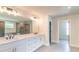 Bright bathroom with a double sink vanity, quartz countertops, and tile flooring at 2475 Adair Ridge Ct, Decatur, GA 30034