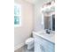 Bright bathroom with a white vanity, matte black faucet, and ample natural light at 2475 Adair Ridge Ct, Decatur, GA 30034