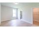 Minimalist bedroom featuring hardwood floors, natural light, and walk-in closet at 2475 Adair Ridge Ct, Decatur, GA 30034