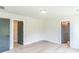 Neutral bedroom featuring hardwood floors, light walls, and three doors at 2475 Adair Ridge Ct, Decatur, GA 30034