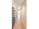 Hallway with hardwood floors, neutral walls, and three gray doors at 2475 Adair Ridge Ct, Decatur, GA 30034