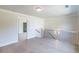 Second floor landing with hardwood floors, neutral walls, and a wooden banister with black railings at 2475 Adair Ridge Ct, Decatur, GA 30034