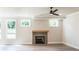 Cozy living room features hardwood floors, a tiled fireplace, recessed lights, and natural light at 2475 Adair Ridge Ct, Decatur, GA 30034