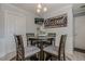 Inviting dining area with warm lighting and a built in tv at 557 Bradford Park, Loganville, GA 30052