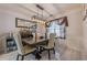 Elegant dining room features modern lighting, a bar and beverage fridge for entertaining at 557 Bradford Park, Loganville, GA 30052