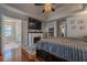 Inviting main bedroom with tray ceilings, hardwood floors, and ample natural light at 557 Bradford Park, Loganville, GA 30052