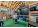 Rustic shed interior featuring multiple screens, stereo equipment, bar, and heating unit at 557 Bradford Park, Loganville, GA 30052