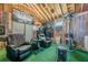 Recreational shed featuring a bar area, multiple chairs, climate control, and sports decor at 557 Bradford Park, Loganville, GA 30052