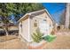 Backyard shed with white trim, a decorative sign, and a well-maintained yard at 557 Bradford Park, Loganville, GA 30052