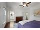 Spacious bedroom with hardwood floors, ceiling fan, and ensuite bathroom access at 610 Timm Valley Ne Rd # B, Atlanta, GA 30305