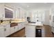 Well-lit kitchen with a copper sink, white cabinets, stainless steel appliances, and hardwood floors at 610 Timm Valley Ne Rd # B, Atlanta, GA 30305