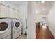 Convenient laundry area with side-by-side washer and dryer, and ample storage cabinets at 610 Timm Valley Ne Rd # B, Atlanta, GA 30305