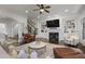 Spacious living room featuring hardwood floors, a fireplace, and built-in bookshelves at 610 Timm Valley Ne Rd # B, Atlanta, GA 30305