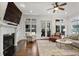 Inviting living room with a fireplace, large windows, and hardwood floors at 610 Timm Valley Ne Rd # B, Atlanta, GA 30305