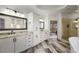 This luxurious main bathroom features a large soaking tub, walk-in shower, and and sinks at 610 Timm Valley Ne Rd # B, Atlanta, GA 30305