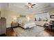 Serene main bedroom with a tray ceiling, neutral tones, and abundant natural light at 610 Timm Valley Ne Rd # B, Atlanta, GA 30305