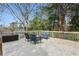 Backyard deck with seating, overlooking a wooded area at 2120 Mckinley Nw Rd, Atlanta, GA 30318