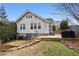 Exterior showcasing the deck, stairs, and grassy backyard of the property at 2120 Mckinley Nw Rd, Atlanta, GA 30318