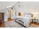 Bedroom featuring hardwood floors, skylights, and a comfortable bed with bright pillows at 2120 Mckinley Nw Rd, Atlanta, GA 30318